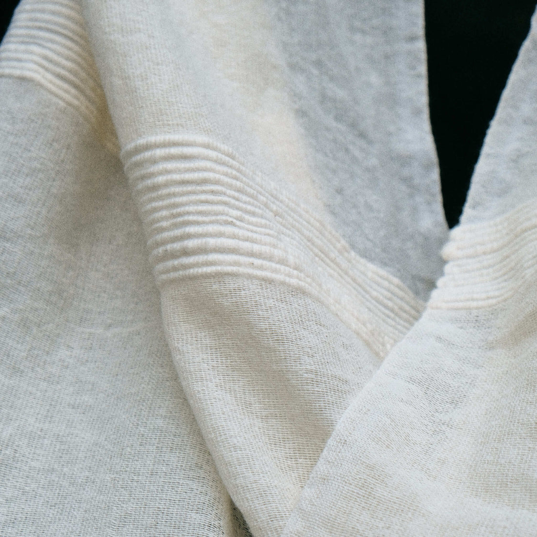 Closeup view of a scarf of different types of cotton